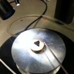 Place the chip on the analyzer, using the probe to contact one of the aluminum dots.