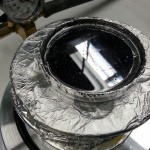 The dish is placed in a vacuum chamber.